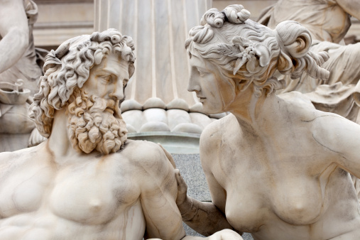 Man And Woman Conversing The Atena Statue In Vienna, Austria