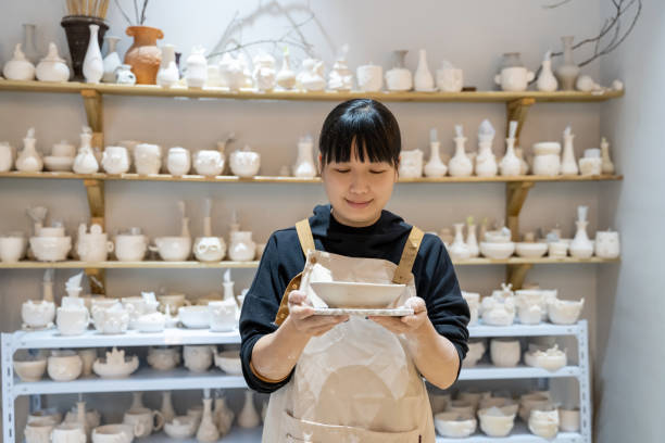 istock A woman is doing pottery at a pottery shop 1576356987
