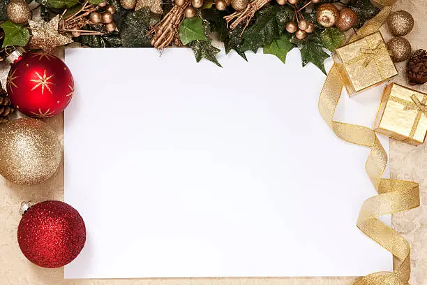 Photo of A blank white space surrounded by Christmas decorations