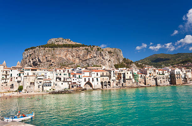 view of Cefalu town and cliff at dusk