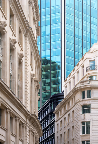 a composition of old and new city buildings in the heart of the Financial Centre of the City of London. This image can depict the harmonious blend of old and new City Architecture.