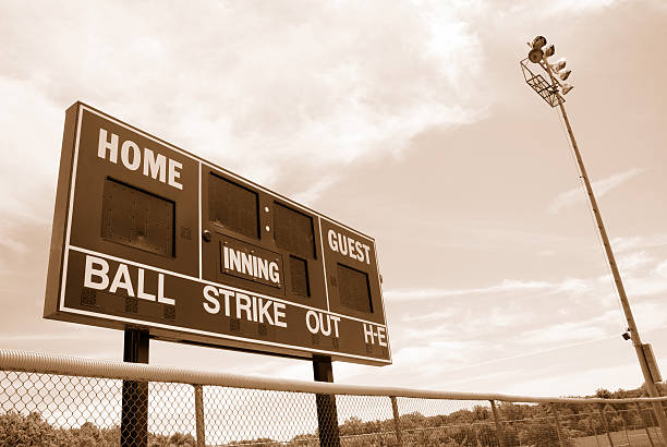 istock Baseball or softball scoreboard with night lights 157636464