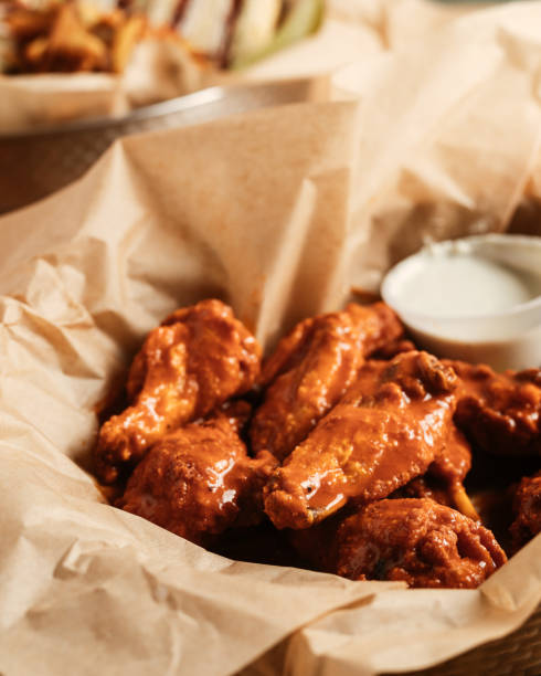 istock Chicken wings in a basket 1576364643