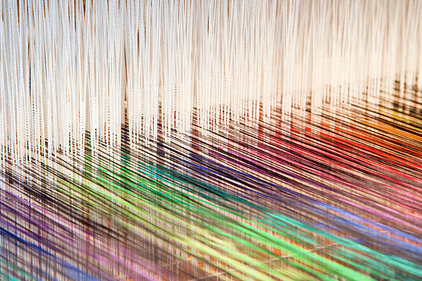Colorful threads on a loom (XXL) Colorful threads on an old-fashioned loom (XXL) woven fabric stock pictures, royalty-free photos & images