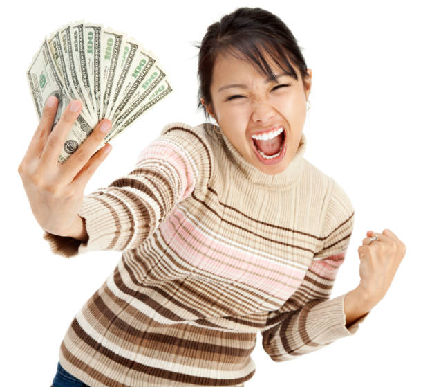 istock Excited Young Woman Holding Money 157636485
