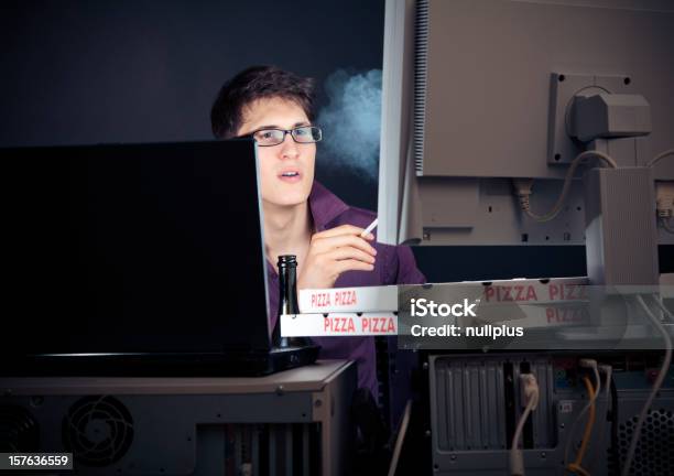 Young Man Spending His Night With Computers Stock Photo - Download Image Now - 20-29 Years, Addiction, Adult