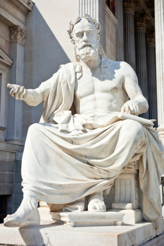 Marble statue of Greek philoshopher Plato (middle) outside the Academy of Athens main building, in central Athens. Plato was a philosopher in Classical Greece and the founder of the Academy of Athens.