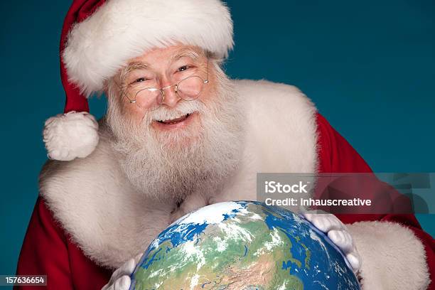 Pictures Of Real Santa Studying Globe With North Pole Stock Photo - Download Image Now