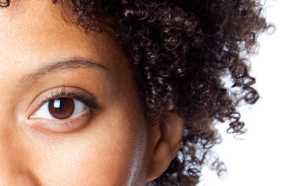 close-up of african american woman - brown eyes fotografías e imágenes de stock