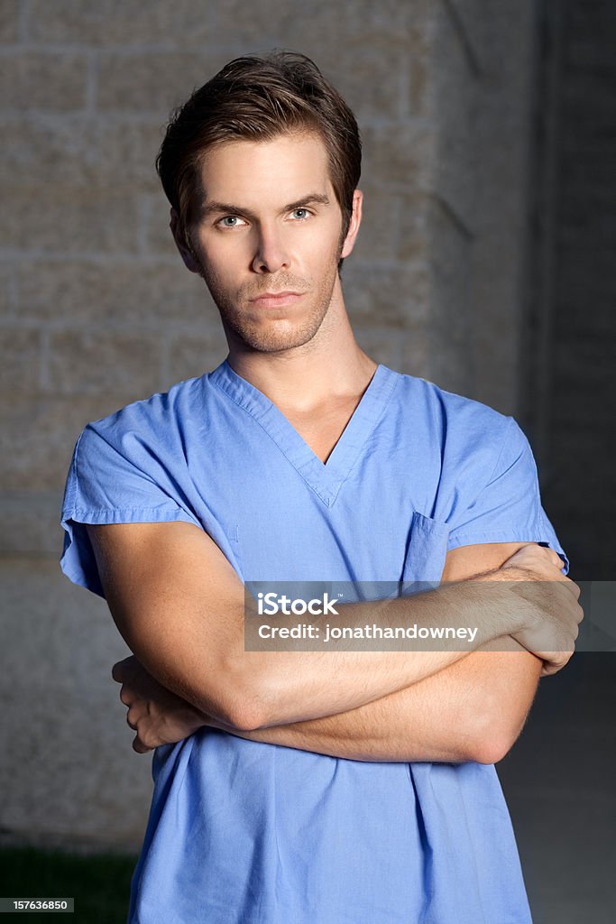 Young Man in Scrubs  Arms Crossed Stock Photo