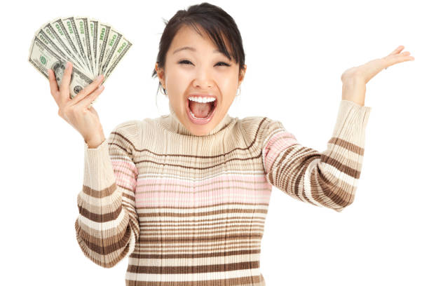 istock Excited Young Woman Holding Money 157636896
