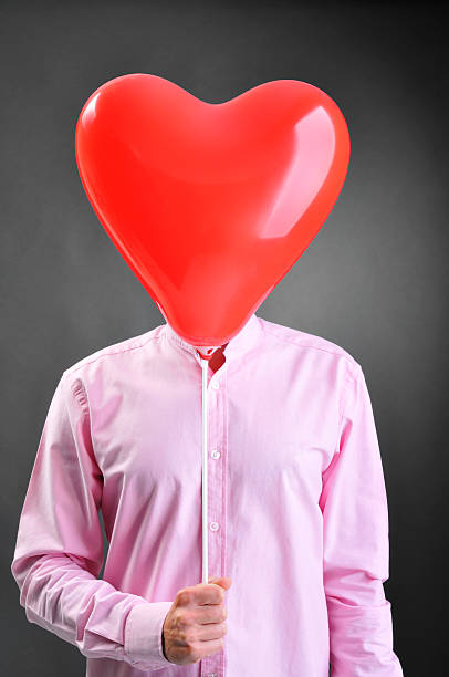 istock Fall in love man has heart-shaped balloon instead of head 157636927