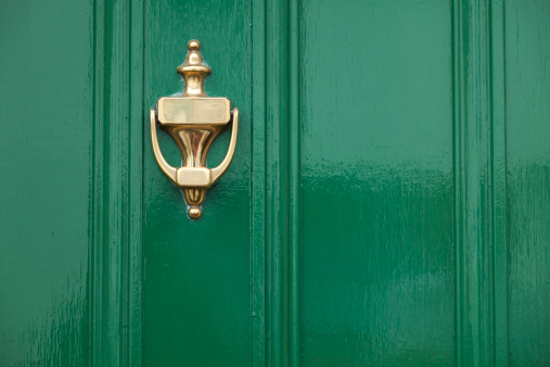 Close up view of green door with brass knocker. Taken with Canon 5D Mark2