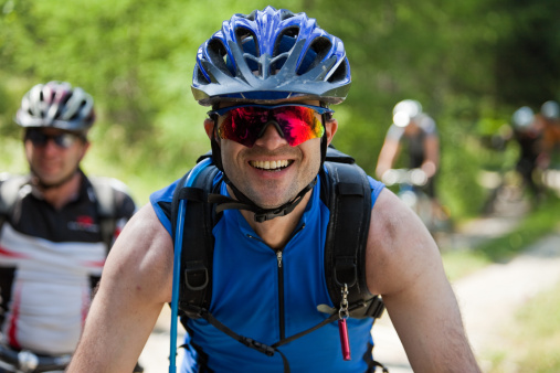 A male mountainbiker laughing...