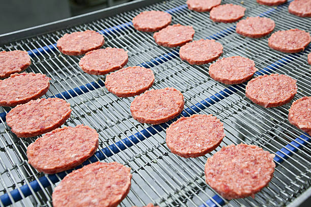 Burgers on Conveyor stock photo