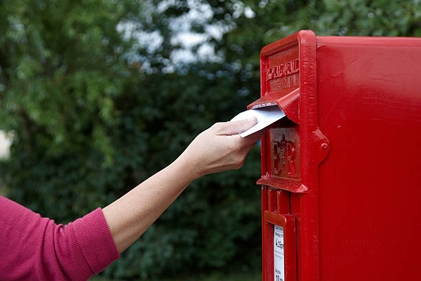 istock Mature woman posting a letter 157637690