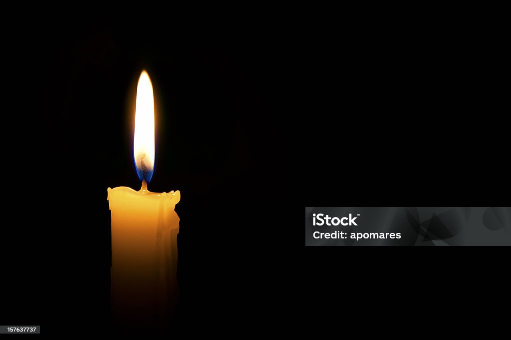 Single lit candle with quite flame Single lit candle with quite flame on black background Candle Stock Photo