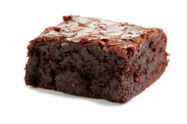 istock Close-up of a single chocolate brownie on a white surface 157637946