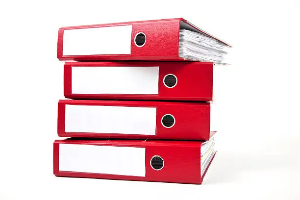 red ring binders against a white background