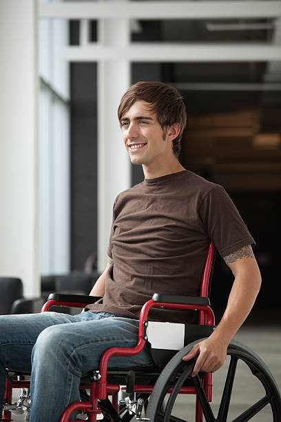 istock Smiling Young Man In Wheelchair 157638133