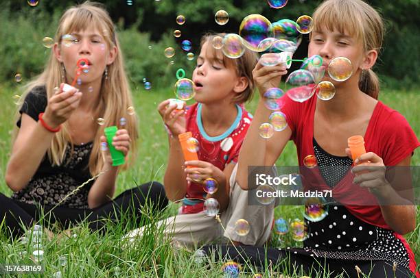 Girls Blowing Bubbles Stock Photo - Download Image Now - Beauty, Beauty In Nature, Blister