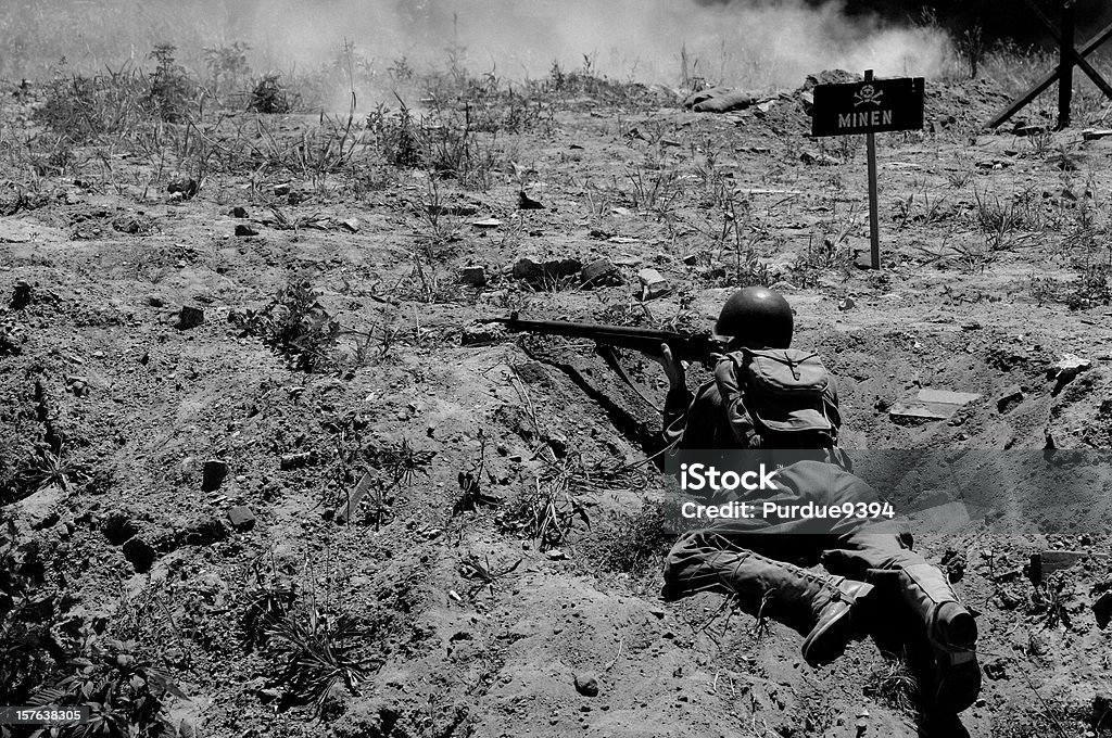 World War 2 D-Day Military Reenactment Soldier Grained Black White B&W image from D-Day landing reenactment.  Teenage reenactor soldier.  RAW source image taken June 6, 2010. World War II Stock Photo