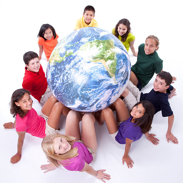 istock Diversity: Interracial Group of Preteens Support Earth Globe Mixed Ethnicity 157638311