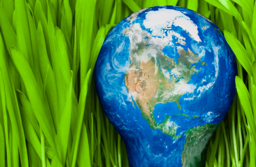 Earth Day. Earth globe in house frame in green background. Environment day, save clean planet, ecology concept. Renewable energy efficient technologies. Climate change and global warming banner