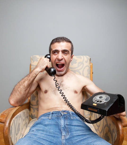 istock Angry man shouting to the phone 157638580