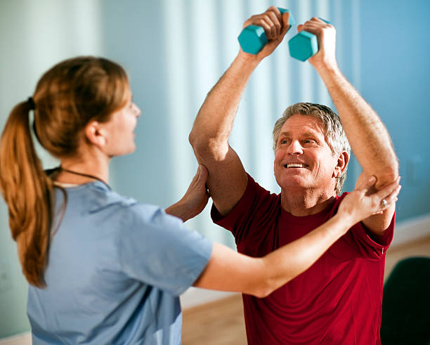 istock Mature Man Working With Female Physical Therapist 157639127