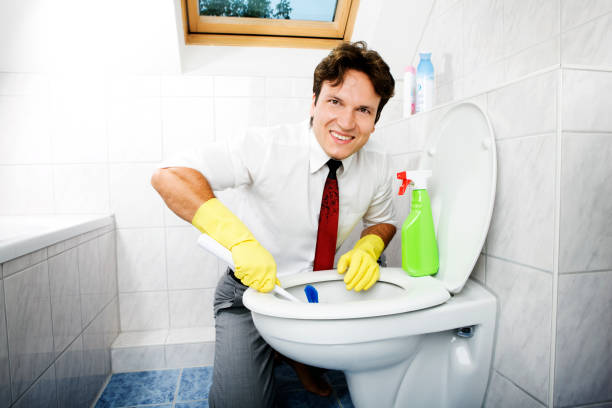 istock cleaning young business man in bathroom 157639440