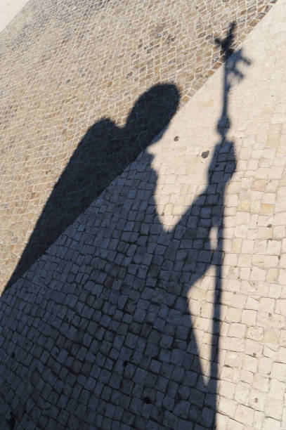 The shadow of Pope John Paul II statues