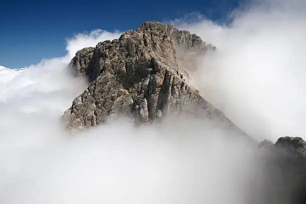 Mytikas - the highest top of the Greek Mt Olympus surrounded by clouds.