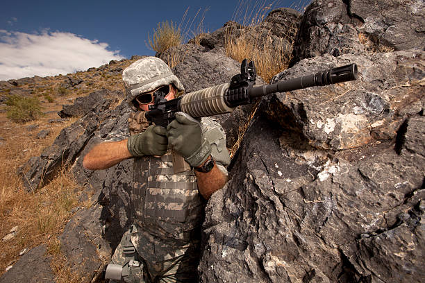istock Special ops military soldier shooting an assault rifle 157639611