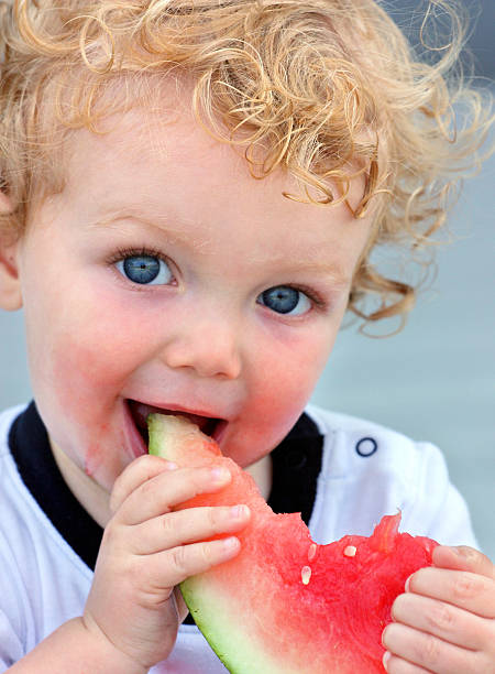 istock Baby Eating Watermelon 157639727