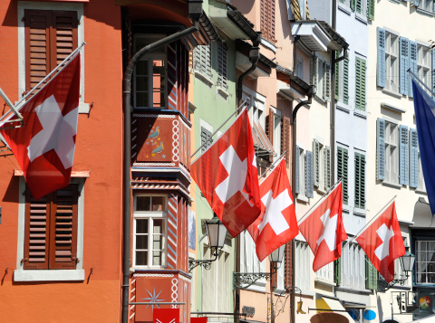 switzerland zurich city with flags on building facade