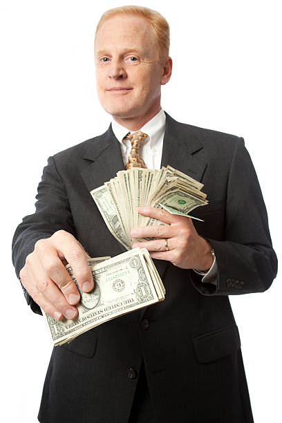 istock Successful businessman with cash in hand 157639919