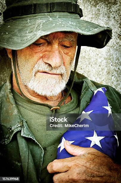 Vietnam Vet With Folded Flag Recalls The War Stock Photo - Download Image Now