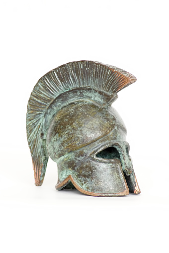 Ancient Roman helmet, vintage soldier armor to protect the head in battle, isolated on a white background. Reconstruction of military events during the wars of the Roman Empire