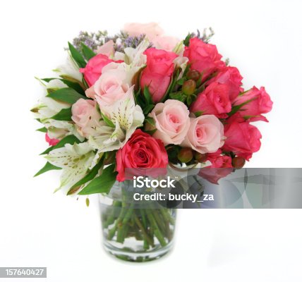 istock Flower and rose arrangement upright in a glass vase. 157640427