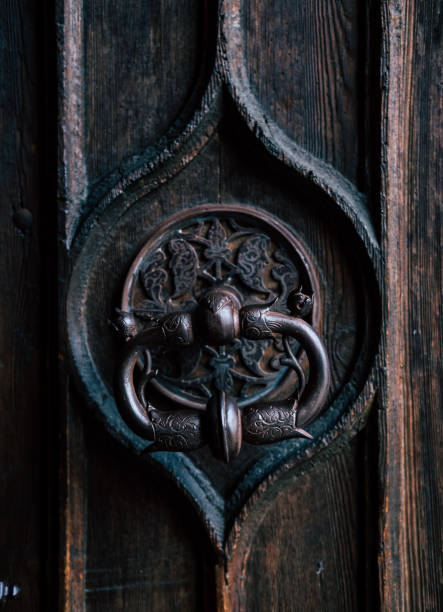 istock Old dark wooden door. 1576405437