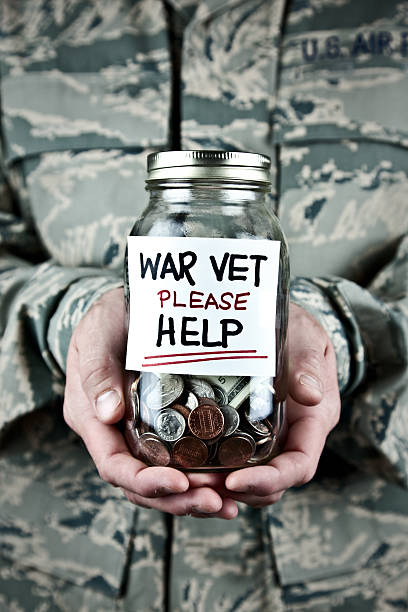 istock US War Veteran Holding Donation Jar 157640611