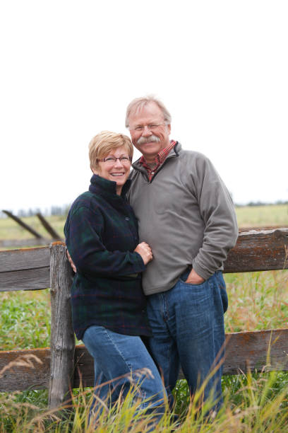 istock Farm Couple by Fence 157640634