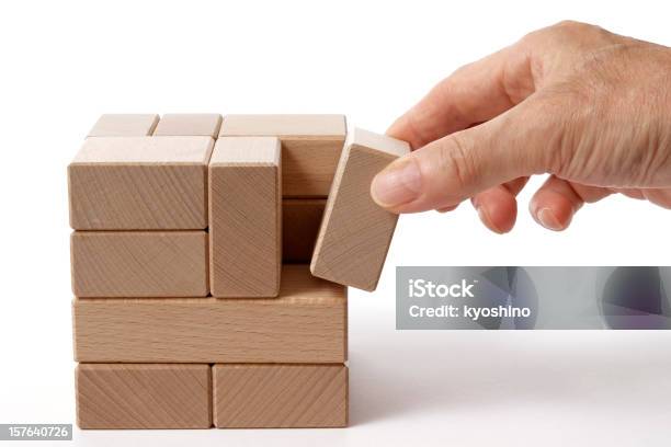 Isolated Shot Of Holding A Wood Block On White Background Stock Photo - Download Image Now