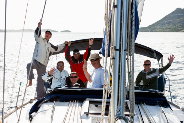 istock Happy sailing crew on sailboat 157640899