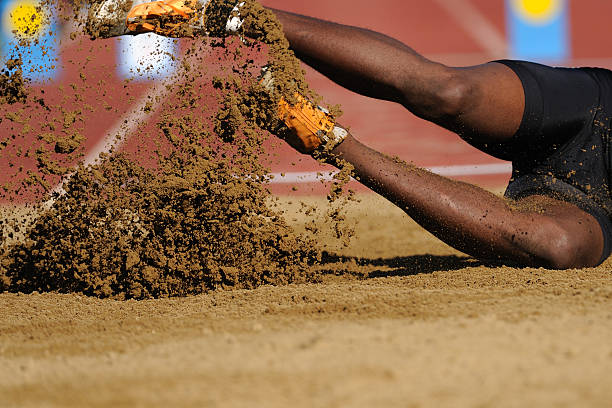 Salto em Comprimento - fotografia de stock