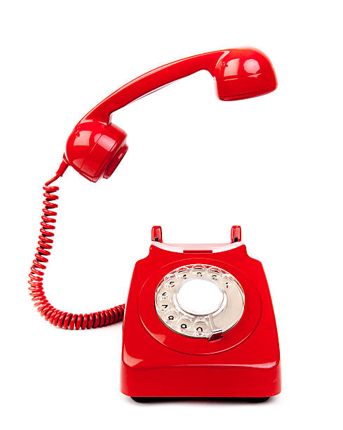 Red rotary dial telephone with cord on white background  red phone with receiver off the hook blue pay phone stock pictures, royalty-free photos & images