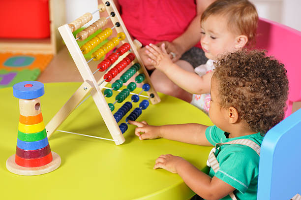 istock Biracial Baby Boy And Peer Playing With An Abacus 157641188