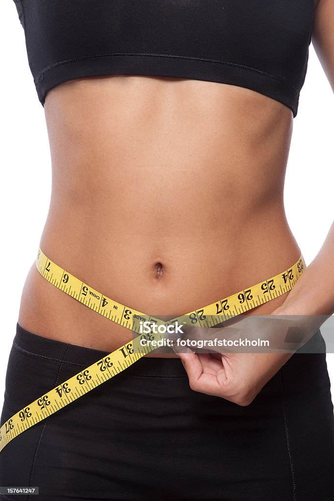 Bela mulher, medindo a altura da cintura - Foto de stock de Balança royalty-free