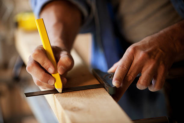 istock Carpenter Marking a Wooden Plank 157641250